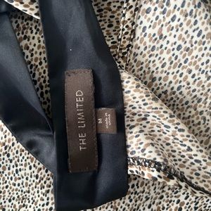 The limited brown printed halter back tie top